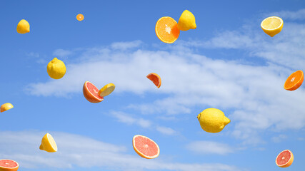 Summer citrus fruit flying on a blue sky with clouds. Summer surreal aesthetic concept.