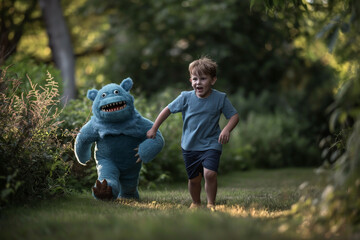 Fototapeta premium A child boy playing with his imaginary friend