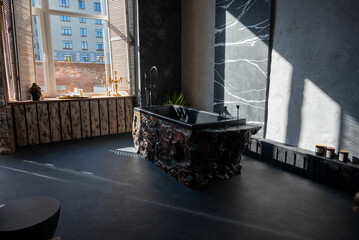 luxury room made of black marble and black bathtub