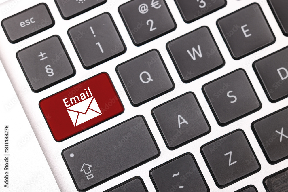 Aufkleber red button with word email and illustration of envelope on laptop keyboard, top view