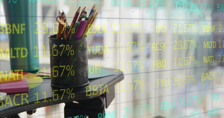 School supplies rest in holder, reflecting stock market numbers