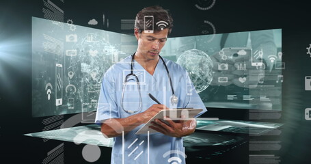 Caucasian male doctor wearing scrubs, writing on clipboard