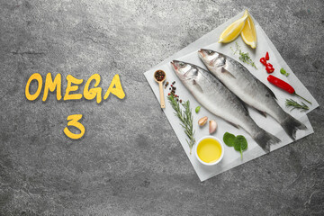 Omega 3. Fresh fish, herbs and spices on grey table, top view