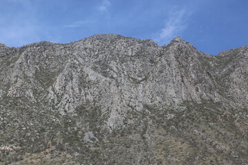 rocky hillside with blue sky