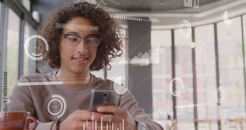 Aufkleber image of round scanner against biracial man smiling while using a smartphone at office