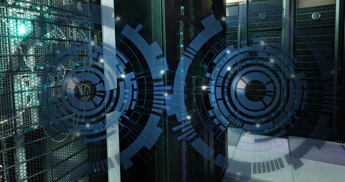 Image of two blue round scanners spinning against computer server room