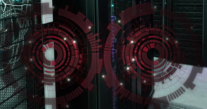 Image of two red round scanners spinning against computer server room - Powered by Adobe