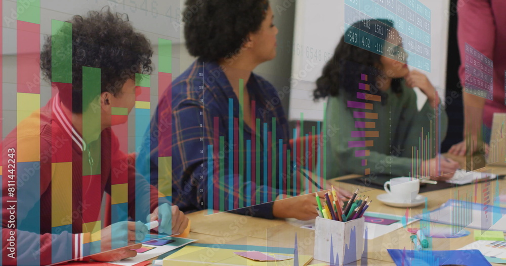 Poster image of graphs and number charts over diverse man explaining cellphone design with coworkers
