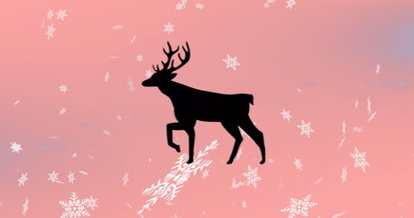 Image of reindeer over snow falling