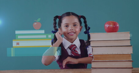 Biracial student wearing school uniform, smiling behind books