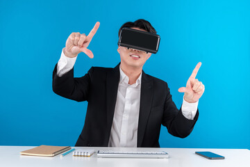 Asian businessman looking through VR connecting zoom out in analyzing business world news...
