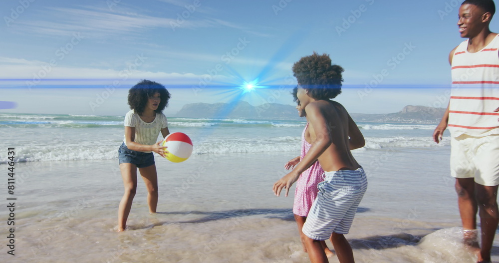 Canvas Prints Image of light spots over african american family at beach