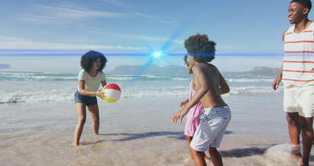 Image of light spots over african american family at beach