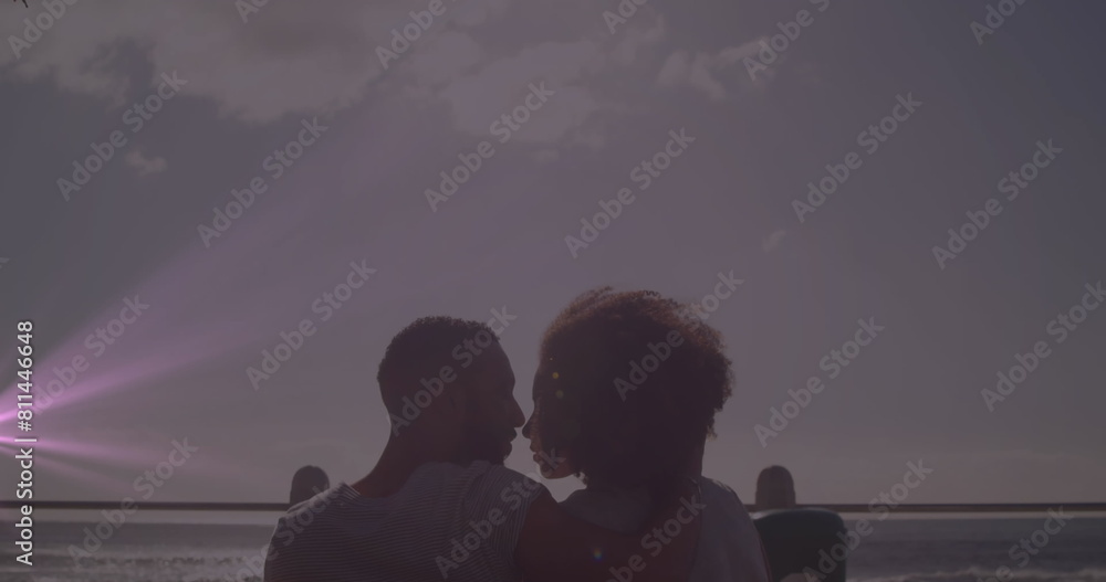 Sticker Image of light spots over diverse couple kissing