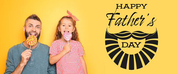 Funny portrait of father and his little daughter with lollipops on color background