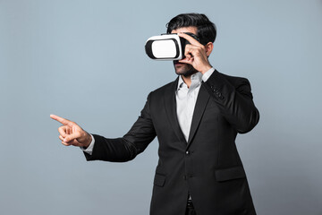 Project manager with virtual reality glasses looking at data analysis while analyzing and pointing...