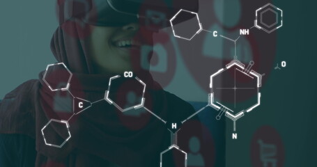 Image of chemical formulas over middle eastern woman in vr headset