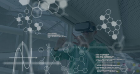 Image of data processing over caucasian businesswoman using vr headset in office