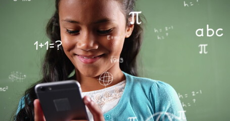 Image of mathematical equations over biracial girl using smartphone