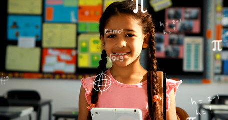 Image of mathematical equations over biracial girl using tablet