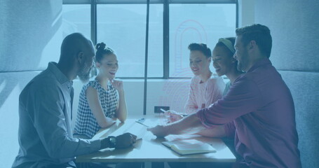 Obraz premium Image of padlock icon over diverse business people having meeting at office