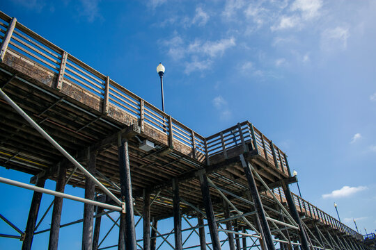 Underside of pier with sky