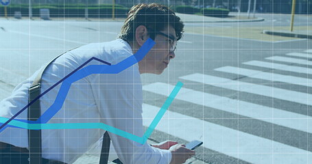 Image of financial data processing over asian businessman using smartphone