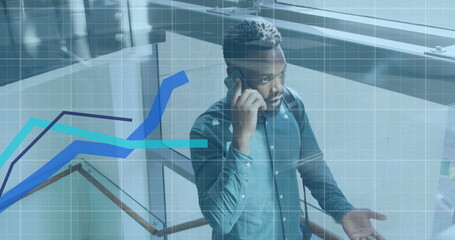 Image of financial data processing over african american businessman using smartphone