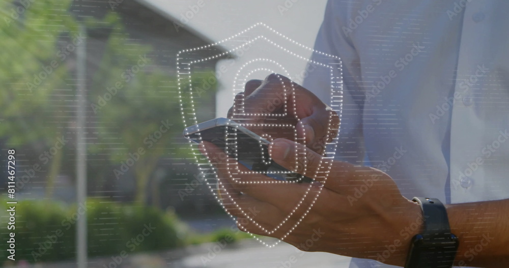 Poster image of padlock in shield over midsection of caucasian man scrolling on smartphone