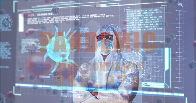 Image of covid 19 cells and data over caucasian male doctor in ppe suit