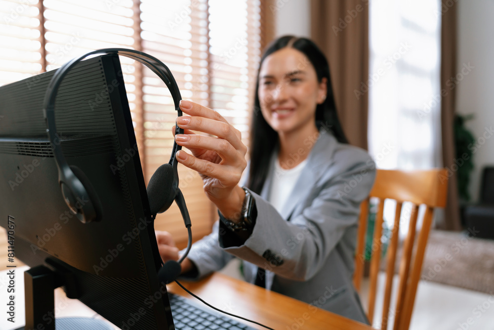Aufkleber female call center operator or customer service helpdesk staff working on workspace while talking on