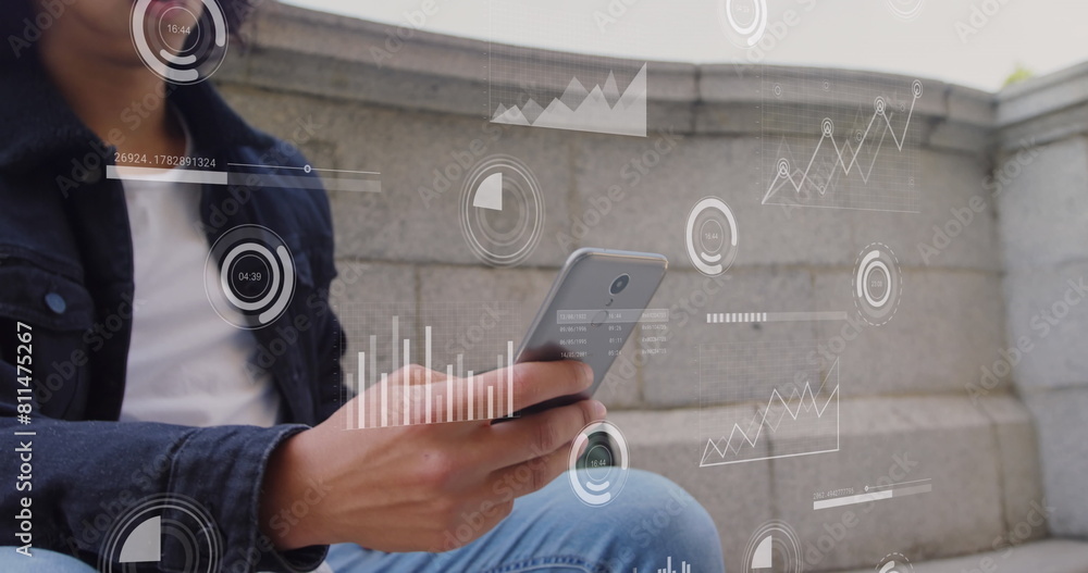 Poster image of multiple graphs and loading bars over low angle view of biracial man using cellphone