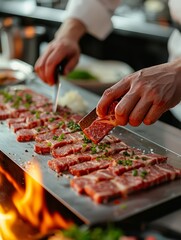 A chef preparing Wagyu beef in a restaurant. There is an open flame for grilling. 