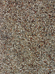 Top view of floor with colorful stones. 