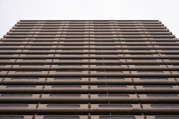 Exterior facade of a brutalist style apartment building in Calgary's downtown.