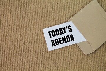 envelopes and colored paper with the words Today's Agenda. the concept of a hidden agenda