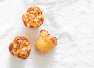 Fresh pastries - brioche buns on a light background, top view