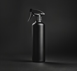 A black spray bottle on a dark background.