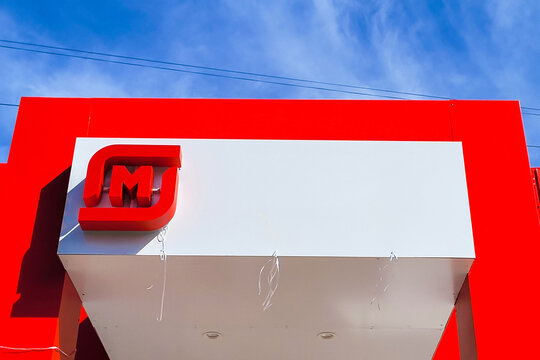 Orenburg, Russia February 10, 2024, Sign with the logo Magnit store. The Magnit chain of stores is a large retail chain in Russia. Supermarket in a residential urban area. editorial