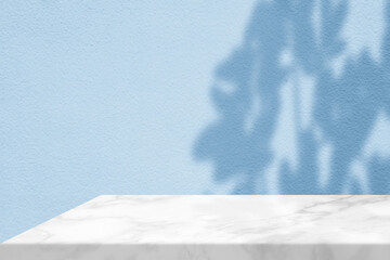 White Marble Table Corner with Light Beam, Shadow, and Spotlight on the Dark Shade of Cyan Blue...