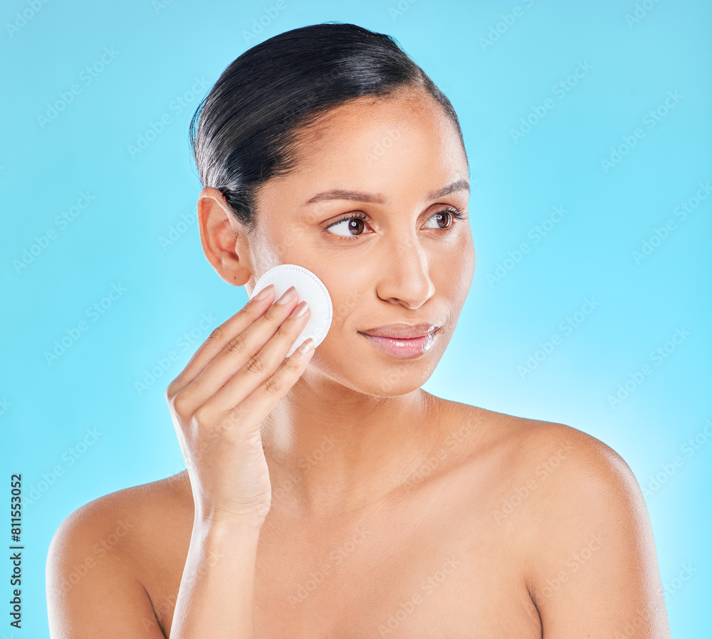 Poster Woman, beauty and exfoliating with skincare glow from spa treatment and cosmetics. Model, hand and face of a person relax after dermatology detox in a studio with blue background feeling healthy