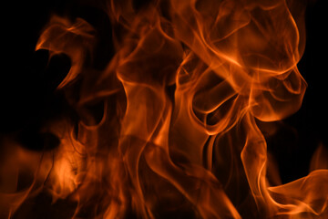 Fototapeta premium Fire blaze flames on black background. Fire burn flame isolated, abstract texture. Flaming explosion with burning effect. Fire wallpaper, abstract art pattern.