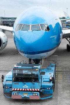 KLM Air France airlines Boeing being pushed back by a pushback tug tractor at Amsterdam Schiphol Airport, the Netherlands, February 21 2024