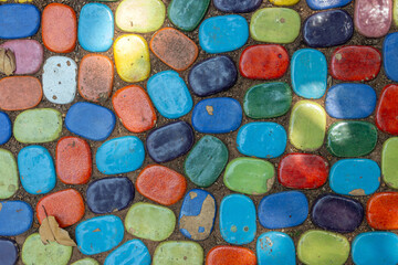 Colorful pebbles placed in the ground