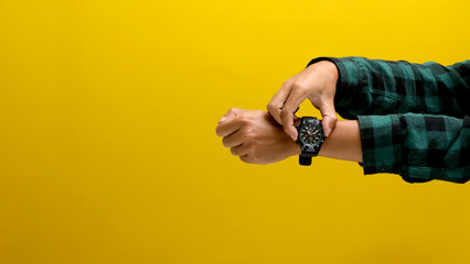 Hand Checking Time on a Wristwatch, Isolated on a White Background