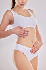 Fitness, underwear and hand of woman on stomach for wellness, digestion and lose weight body...