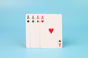 Ace cards arranged on a blue background.