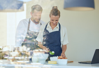 Baking, flour and couple in kitchen of home with laptop for learning recipe together on vacation. Happy, chef and partner cooking with support, help and care in marriage with meal prep or food