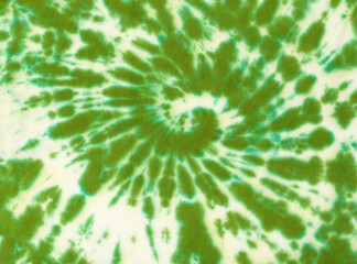 White and green pattern on white fabric in tie dye style.