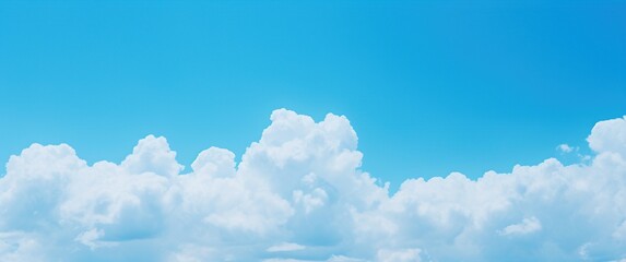 Clear blue sky background with tiny clouds.